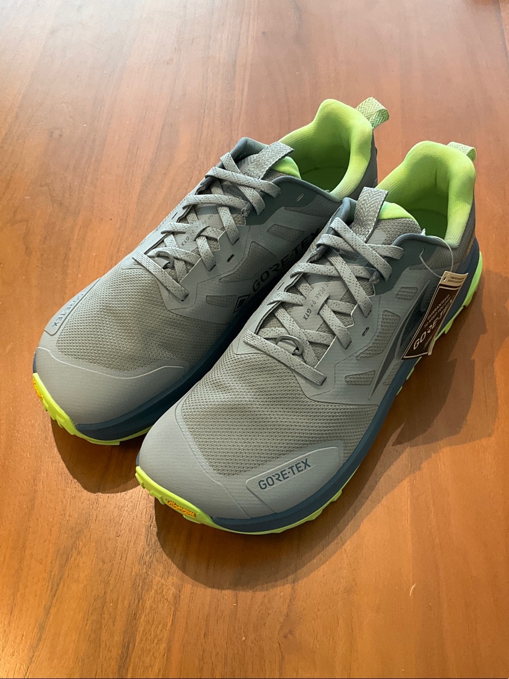 Lone Peak 9+ GTX. Altra Men's Athletic Trail Shoes in Gray with Neon Gr sample